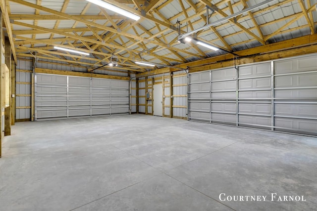 414 135th Ave, Wayland, MI 49348 - garage featuring a garage door opener and metal wall