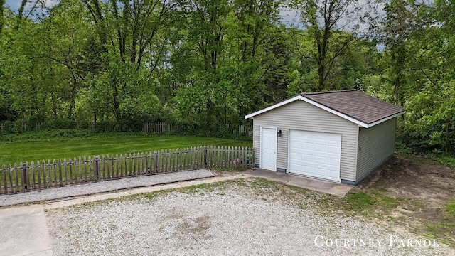 414 135th Ave, Wayland, MI 49348 - detached garage with driveway and a forest view