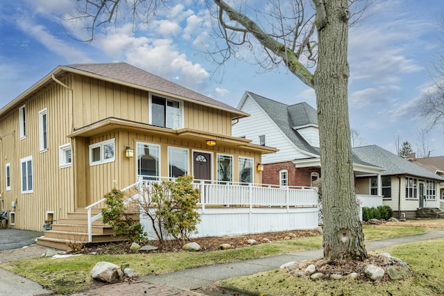 1701 Forres Ave, Saint Joseph, MI 49085 - view of front of home featuring roof with shingles, covered porch, and board and batten siding