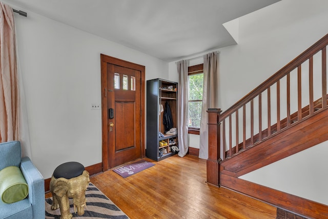 710 S 1st St, Ann Arbor, MI 48103 - entryway with stairway, wood finished floors, and baseboards
