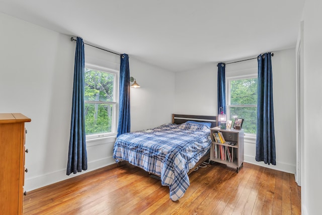 710 S 1st St, Ann Arbor, MI 48103 - bedroom featuring wood-type flooring and baseboards