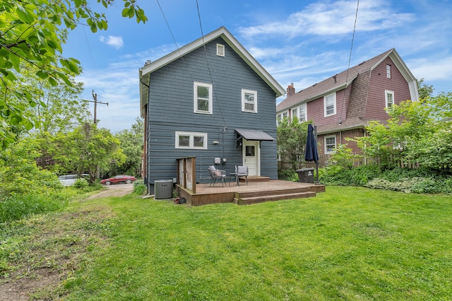 710 S 1st St, Ann Arbor, MI 48103 - back of property featuring a lawn, a deck, and central air condition unit