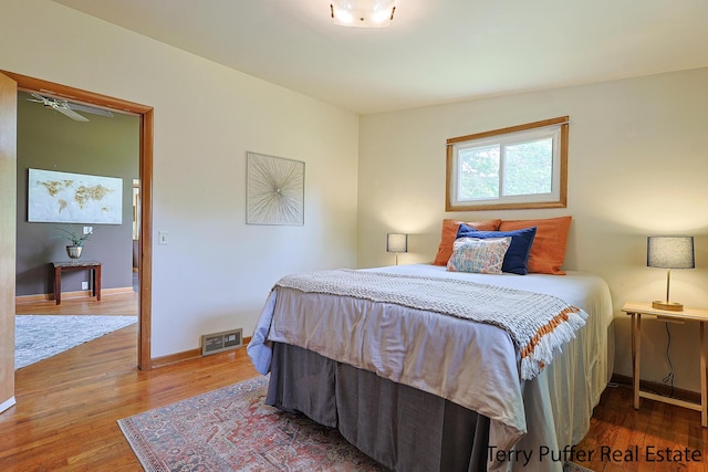 2576 Vine Ave, Muskegon, MI 49442 - bedroom with wood finished floors and baseboards