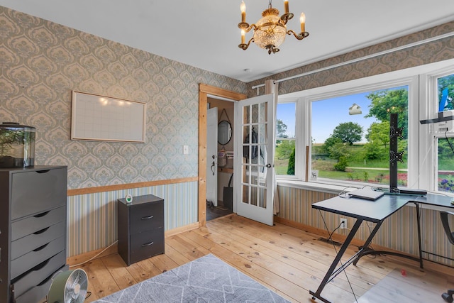 9410 US Highway 12, Brooklyn, MI 49230 - office with wallpapered walls, light wood finished floors, a chandelier, healthy amount of natural light, and french doors