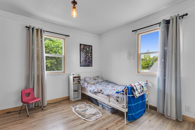 9410 US Highway 12, Brooklyn, MI 49230 - bedroom featuring wood finished floors and baseboards