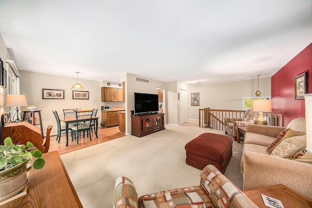 7643 Cottonwood Ln, Dexter, MI 48130 - living room featuring baseboards and light colored carpet