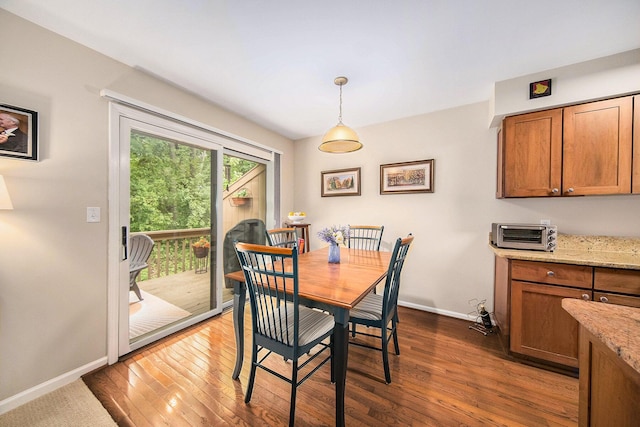 7643 Cottonwood Ln, Dexter, MI 48130 - dining area with baseboards and dark wood finished floors