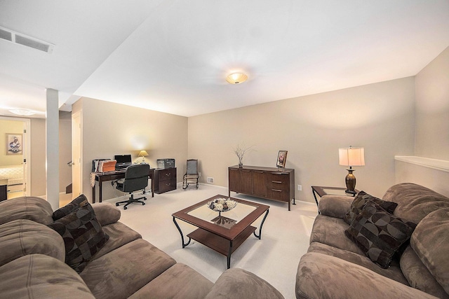 7643 Cottonwood Ln, Dexter, MI 48130 - living area featuring light colored carpet, a desk, and baseboards