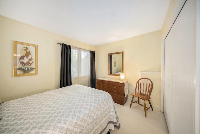 7643 Cottonwood Ln, Dexter, MI 48130 - bedroom with light colored carpet and a closet