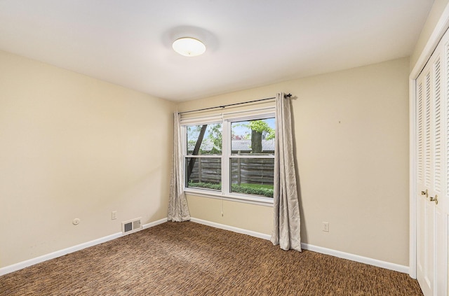 1231 Naples Ct, Ann Arbor, MI 48103 - carpeted empty room featuring baseboards