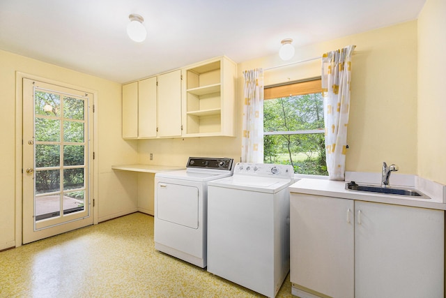 1231 Naples Ct, Ann Arbor, MI 48103 - washroom with cabinet space, washer and dryer, and healthy amount of natural light