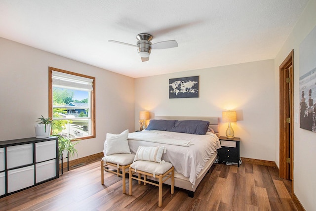 9324 Perry St, Zeeland, MI 49464 - bedroom with wood finished floors, baseboards, and a ceiling fan