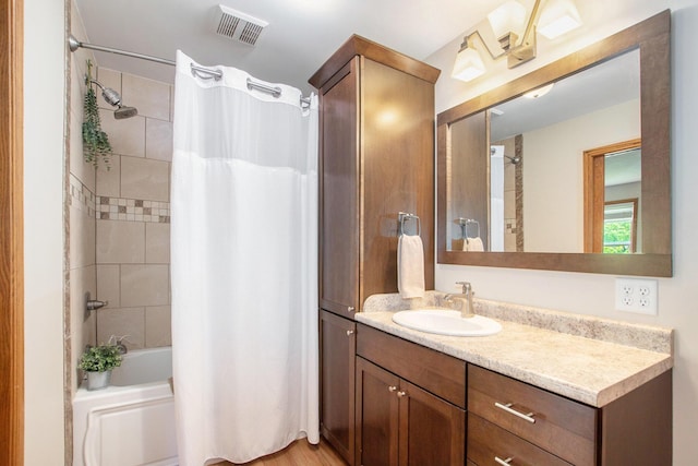 9324 Perry St, Zeeland, MI 49464 - bathroom featuring vanity and shower / bath combo with shower curtain