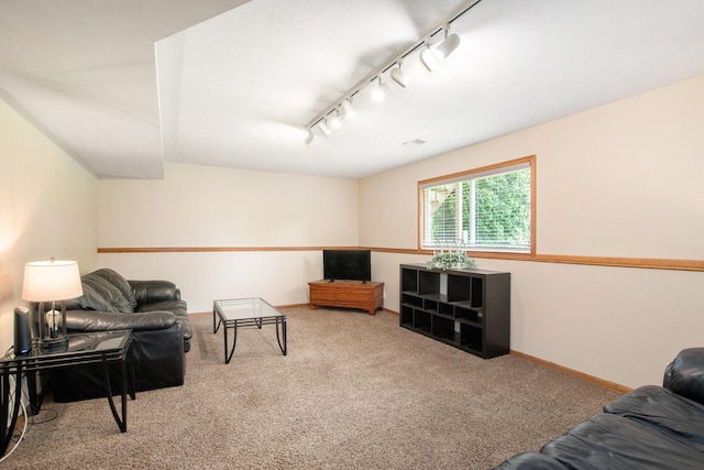 9324 Perry St, Zeeland, MI 49464 - living area with rail lighting, carpet floors, and baseboards
