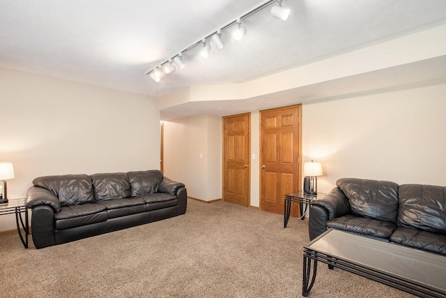 9324 Perry St, Zeeland, MI 49464 - carpeted living room with rail lighting and baseboards