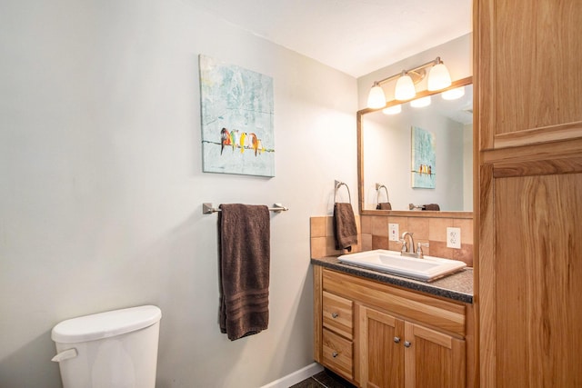 9324 Perry St, Zeeland, MI 49464 - half bathroom with vanity, tasteful backsplash, toilet, and baseboards