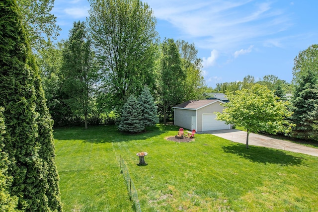 9324 Perry St, Zeeland, MI 49464 - view of grassy yard with a garage