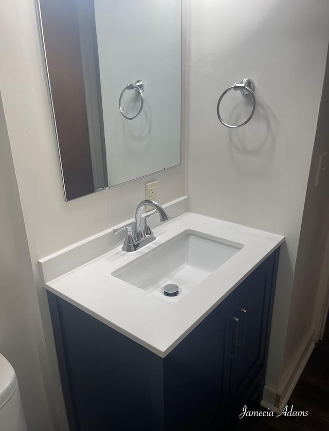 3351 Mona St, Muskegon, MI 49444 - bathroom featuring vanity and toilet