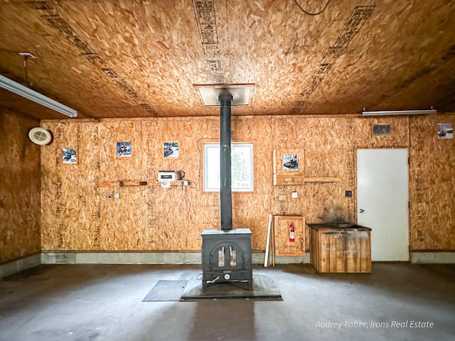 4307 N Mac Rd, Irons, MI 49644 - detailed view of a wood stove and finished concrete floors