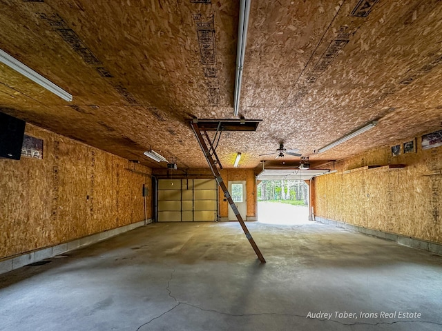 4307 N Mac Rd, Irons, MI 49644 - garage featuring a garage door opener