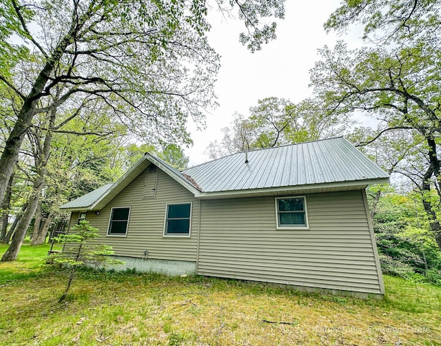 4307 N Mac Rd, Irons, MI 49644 - view of side of home featuring metal roof