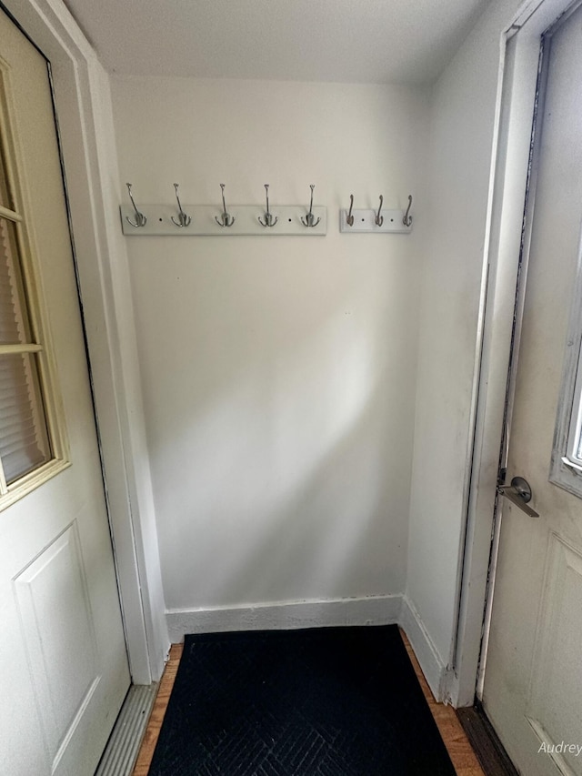 4307 N Mac Rd, Irons, MI 49644 - mudroom featuring light wood-type flooring and baseboards