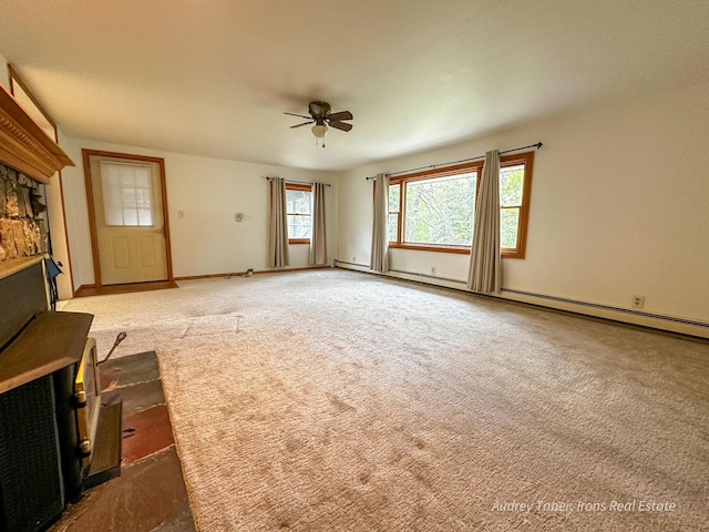4307 N Mac Rd, Irons, MI 49644 - unfurnished living room featuring ceiling fan, carpet, baseboard heating, and baseboards