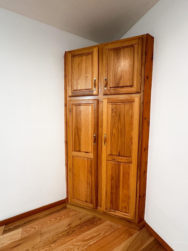4307 N Mac Rd, Irons, MI 49644 - detailed view of wood finished floors and baseboards