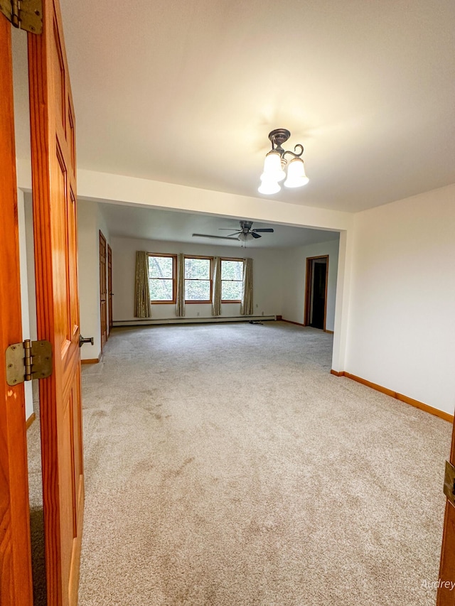 4307 N Mac Rd, Irons, MI 49644 - spare room with light colored carpet, baseboards, and ceiling fan