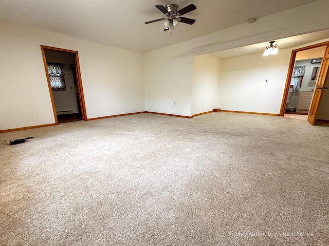 4307 N Mac Rd, Irons, MI 49644 - spare room with a ceiling fan, light carpet, and baseboards
