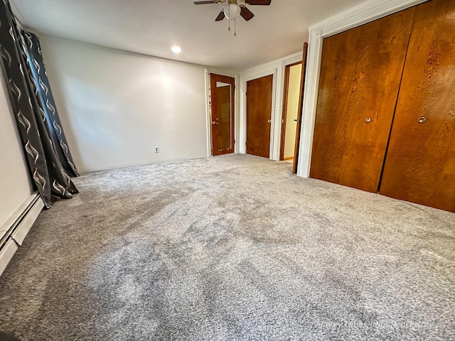 4307 N Mac Rd, Irons, MI 49644 - unfurnished bedroom featuring carpet, multiple closets, and ceiling fan