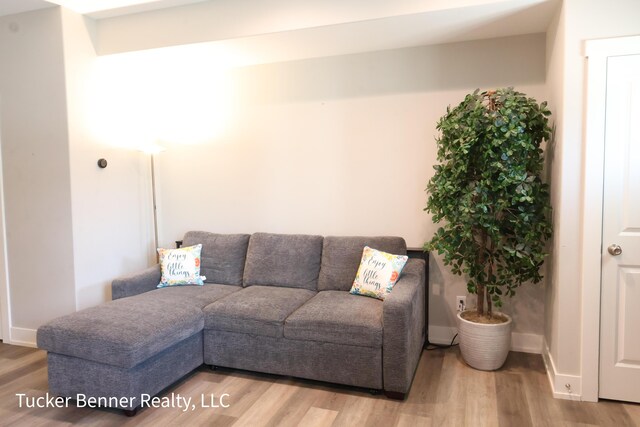 239 Monroe Ave, Muskegon, MI 49441 - living room featuring wood finished floors and baseboards