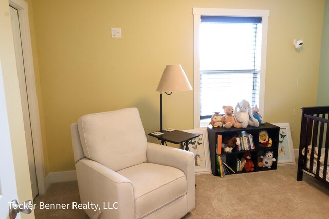 239 Monroe Ave, Muskegon, MI 49441 - living area with plenty of natural light and carpet