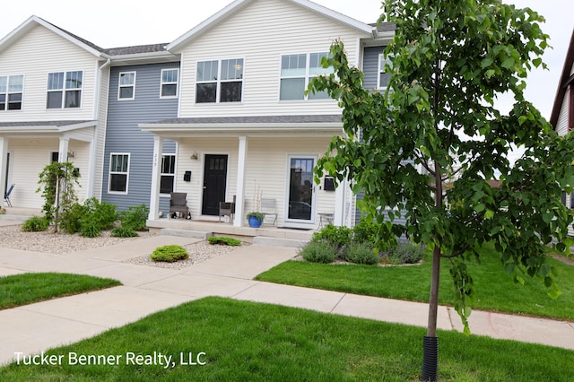 239 Monroe Ave, Muskegon, MI 49441 - multi unit property with a porch and a front yard