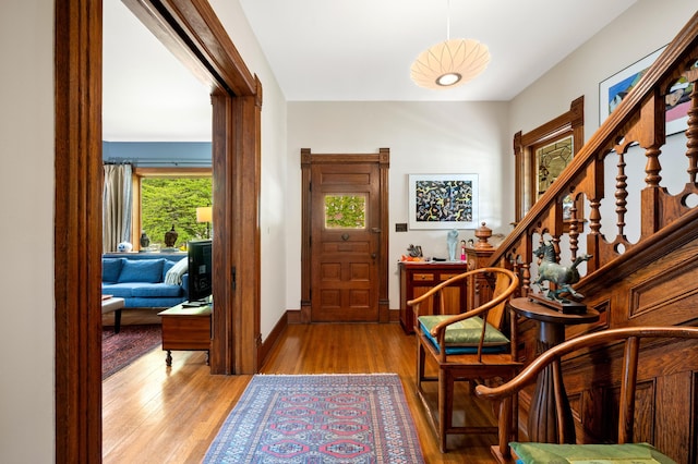 903 Lake Blvd, Saint Joseph, MI 49085 - entryway with light wood-style flooring, baseboards, and stairway