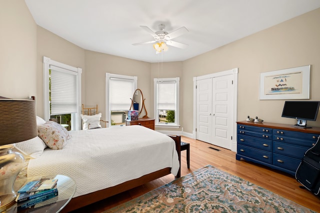 903 Lake Blvd, Saint Joseph, MI 49085 - bedroom featuring light wood-type flooring, a closet, a ceiling fan, and baseboards