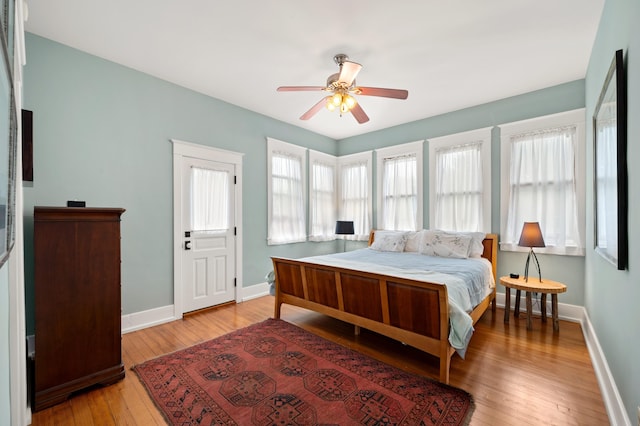 903 Lake Blvd, Saint Joseph, MI 49085 - bedroom with baseboards, light wood-style flooring, and a ceiling fan