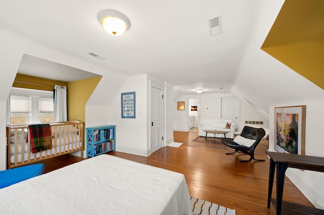 903 Lake Blvd, Saint Joseph, MI 49085 - bedroom featuring hardwood / wood-style floors, baseboards, and lofted ceiling