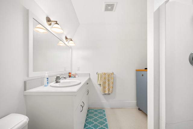 903 Lake Blvd, Saint Joseph, MI 49085 - bathroom featuring vanity, toilet, tile patterned floors, and baseboards