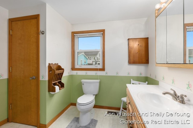 171 Dickerson Vw SW, Stanton, MI 48888 - bathroom featuring toilet, vanity, and baseboards