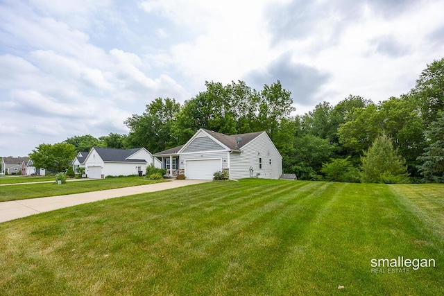 8637 Rainbows End Rd SE, Caledonia, MI 49316 - view of front of house with a front yard, a garage, and concrete driveway