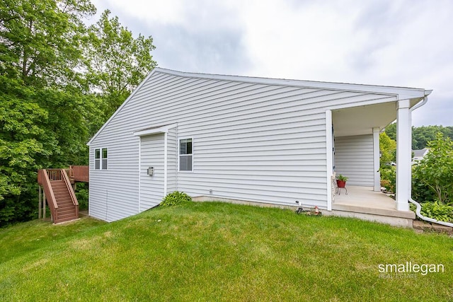 8637 Rainbows End Rd SE, Caledonia, MI 49316 - view of home's exterior featuring a yard, stairs, and a wooden deck