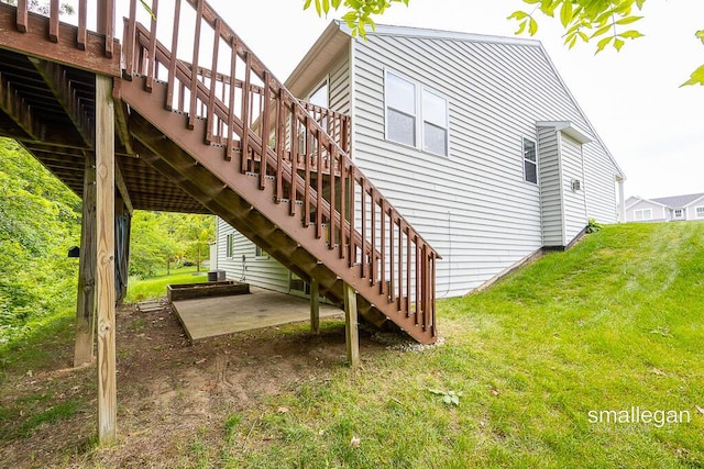 8637 Rainbows End Rd SE, Caledonia, MI 49316 - view of home's exterior with stairs, a patio area, a yard, and a deck