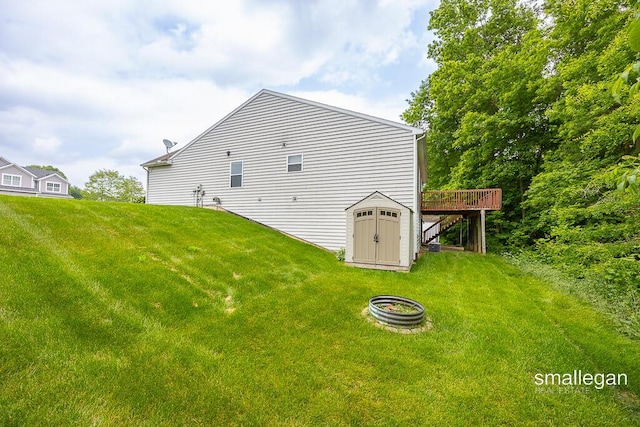 8637 Rainbows End Rd SE, Caledonia, MI 49316 - back of property with a deck and a yard