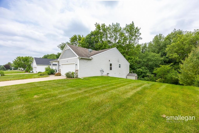 8637 Rainbows End Rd SE, Caledonia, MI 49316 - view of home's exterior with an attached garage, a yard, concrete driveway, and stone siding