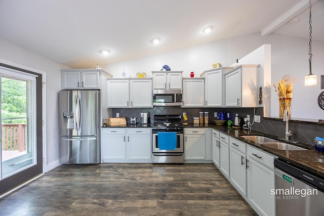 8637 Rainbows End Rd SE, Caledonia, MI 49316 - kitchen featuring appliances with stainless steel finishes, backsplash, and dark wood-style floors