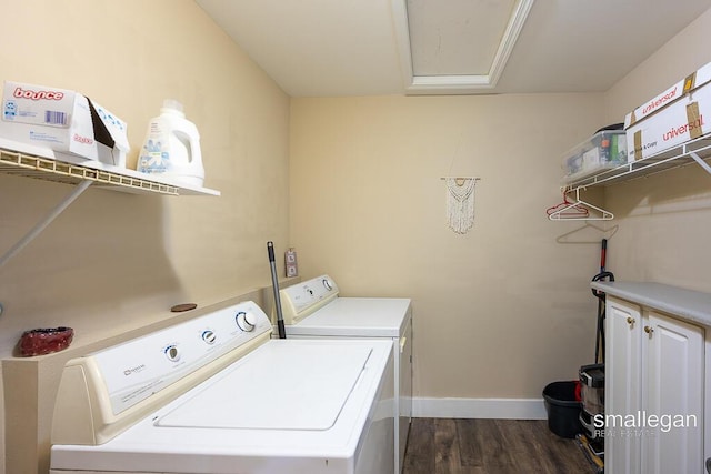 8637 Rainbows End Rd SE, Caledonia, MI 49316 - laundry room featuring washer and dryer, dark wood-style flooring, and cabinet space