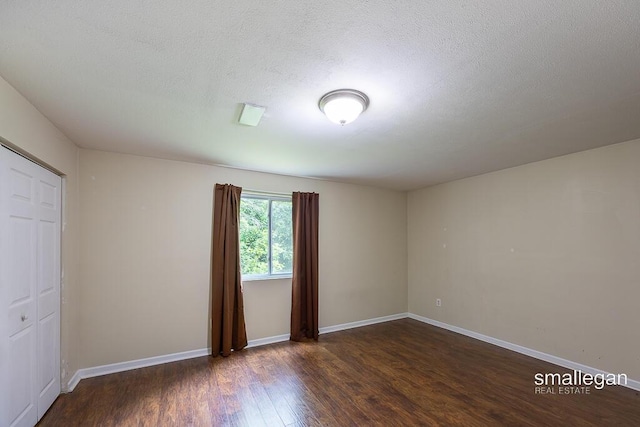 8637 Rainbows End Rd SE, Caledonia, MI 49316 - unfurnished room featuring wood finished floors and a textured ceiling