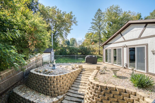 610 Birch St, Big Rapids, MI 49307 - fenced backyard featuring a patio