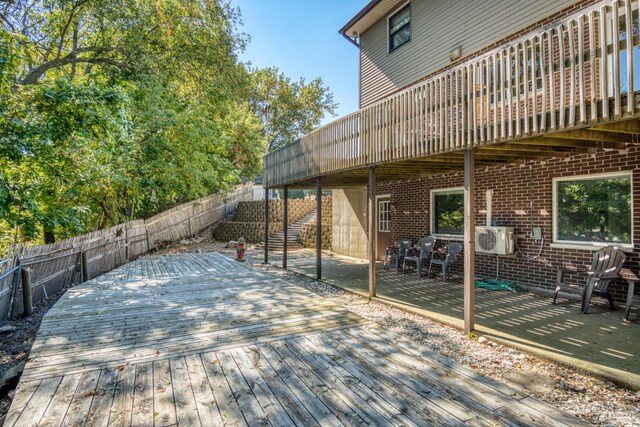 610 Birch St, Big Rapids, MI 49307 - deck featuring a fenced backyard, a cooling unit, and a patio